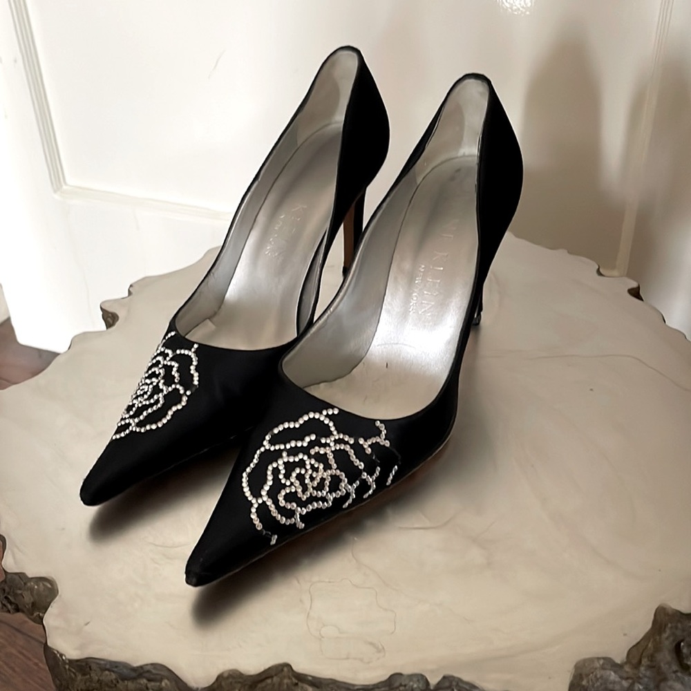 Black satin pumps